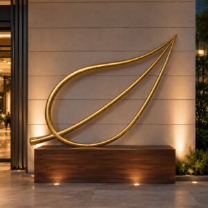 Grand Aurelia Floor Standing Golden Leaf Sculpture resting on floor in luxury living room